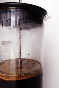 Steeping French Press Coffee Placing the filter at the water level before steeping